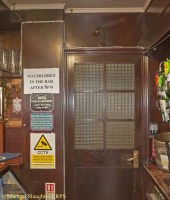 Door to Publicans Office.  by Michael Slaughter. Published on  